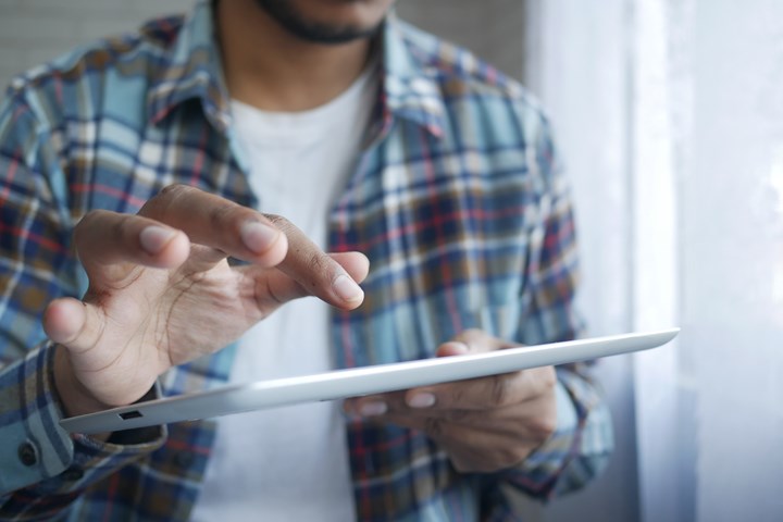 Man Looking At Ipad